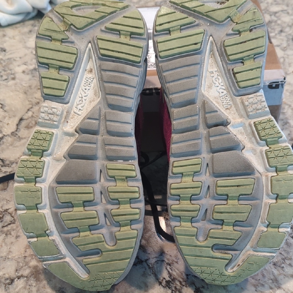 Hoka One One purple running shoes.